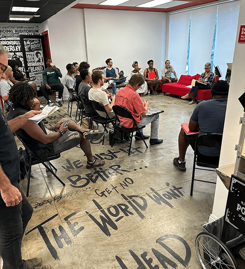 People gathered in a room for a discussion or presentation.