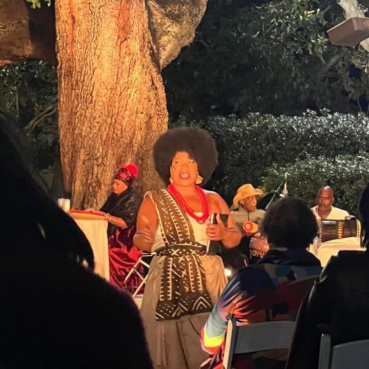 Evening outdoor performance with musicians and audience